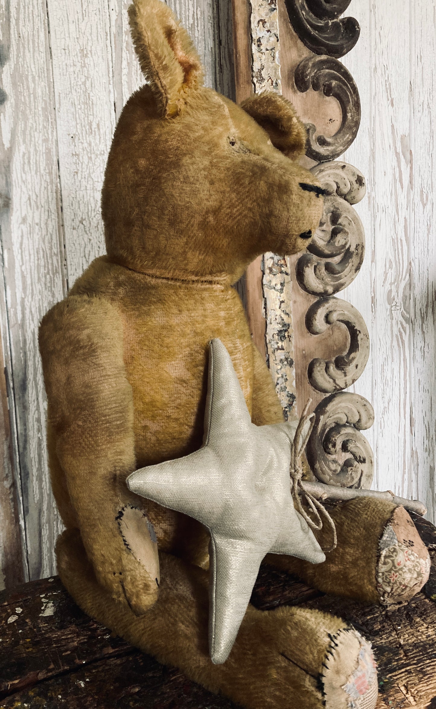 Large antique bear with star.