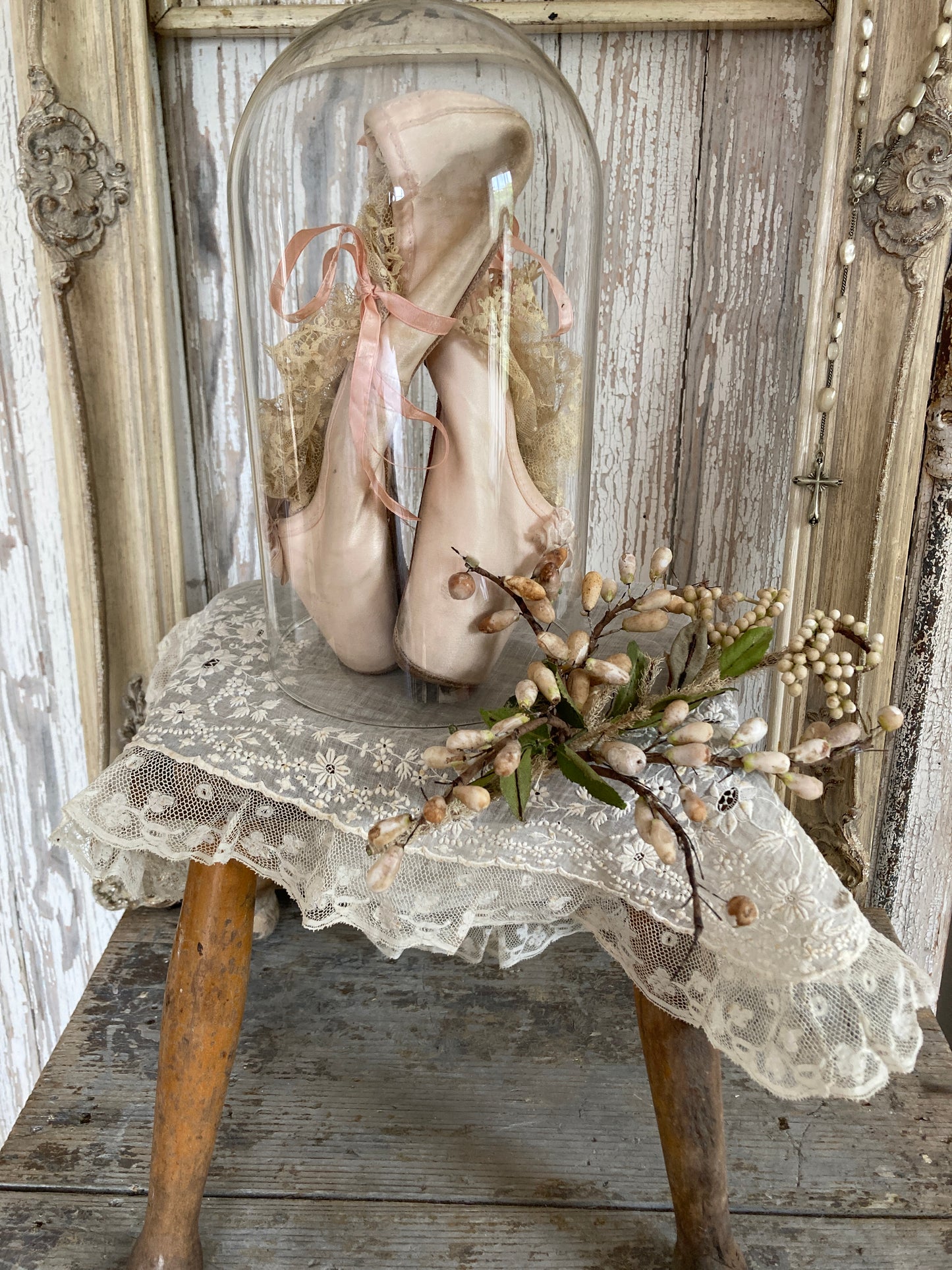 Ballet pointes in glass dome.