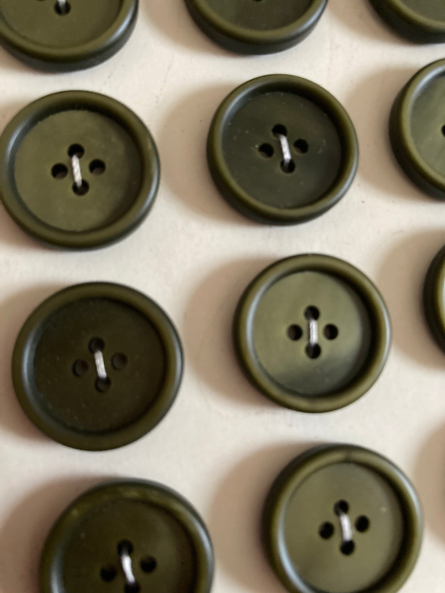 Vintage olive green french buttons.