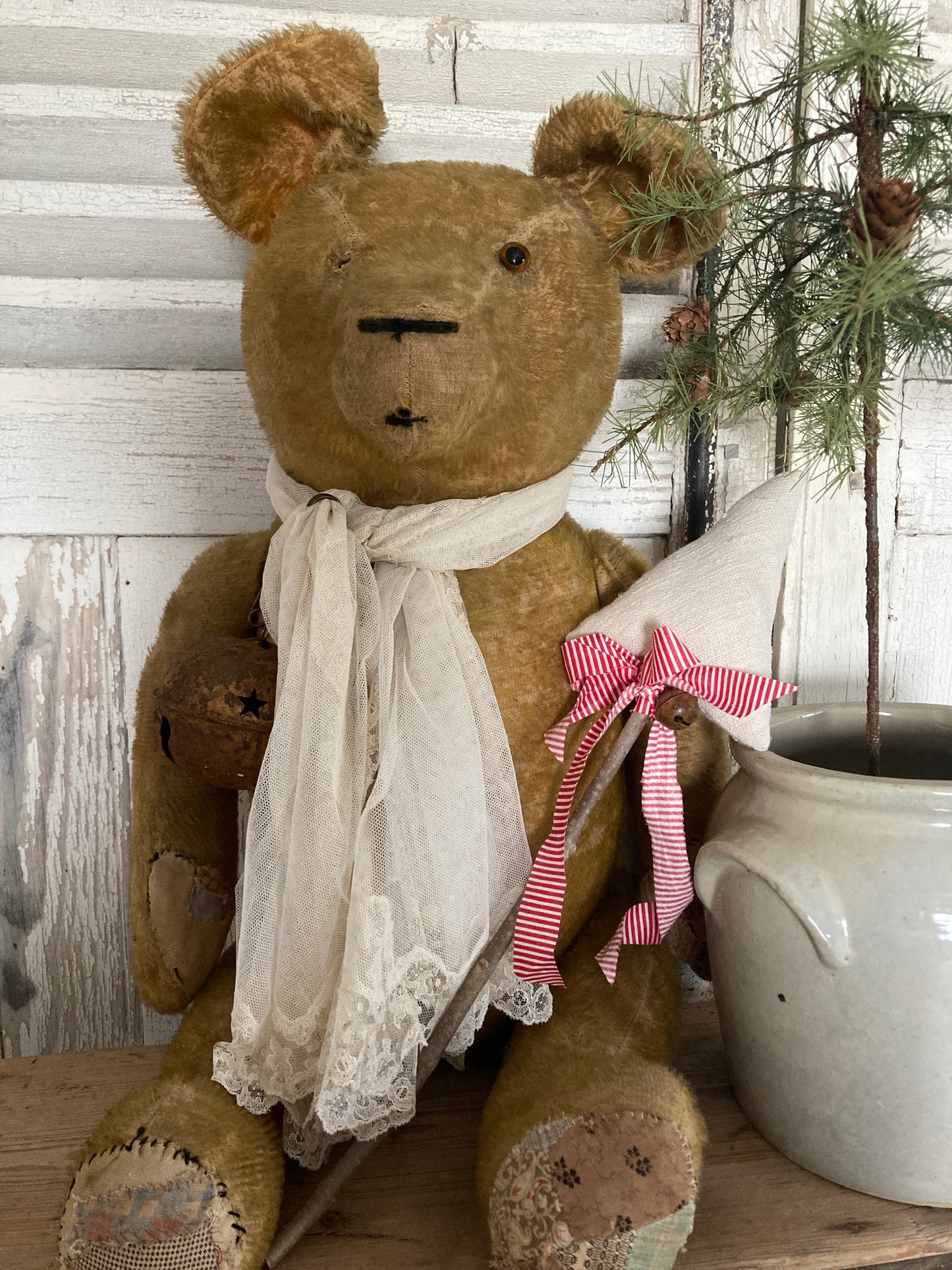 Large antique bear with linen tree.