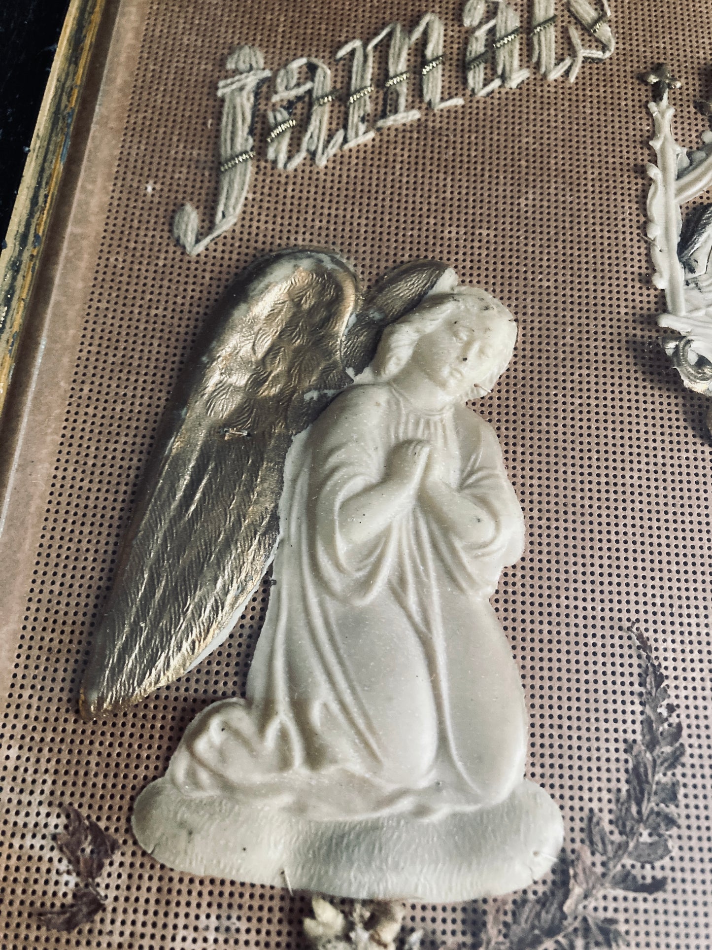 Antique religious kneeling angels.