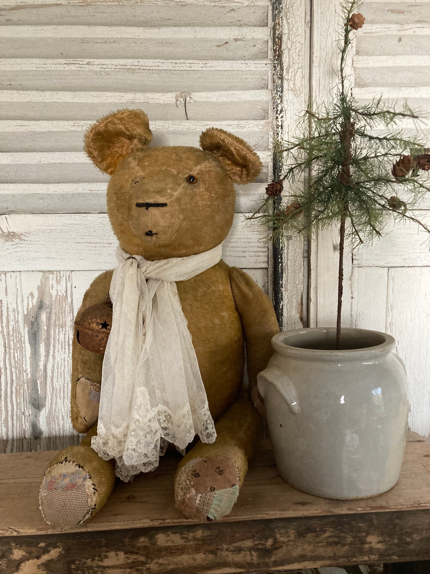 Large antique bear with linen tree.