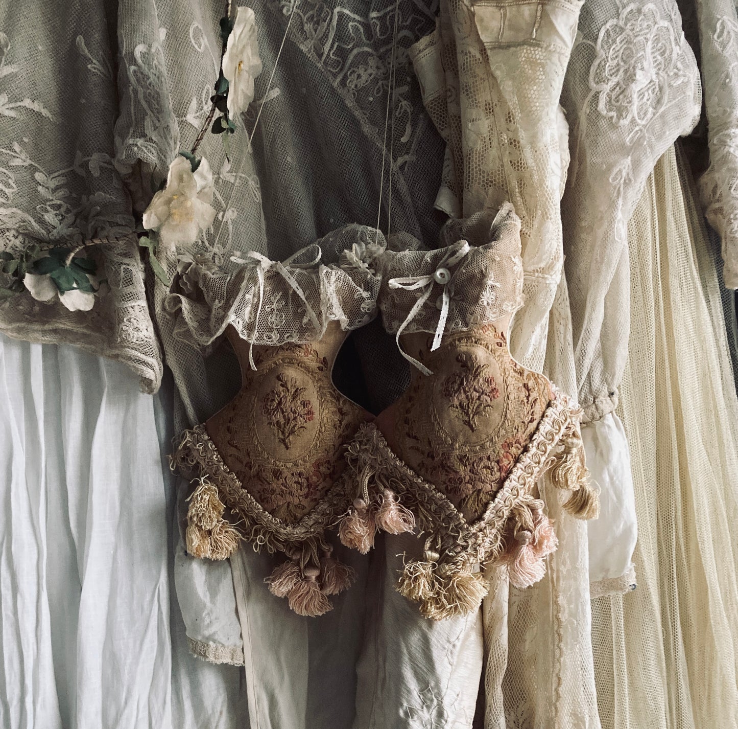 Lavender filled hanging corsets. Antique textiles.