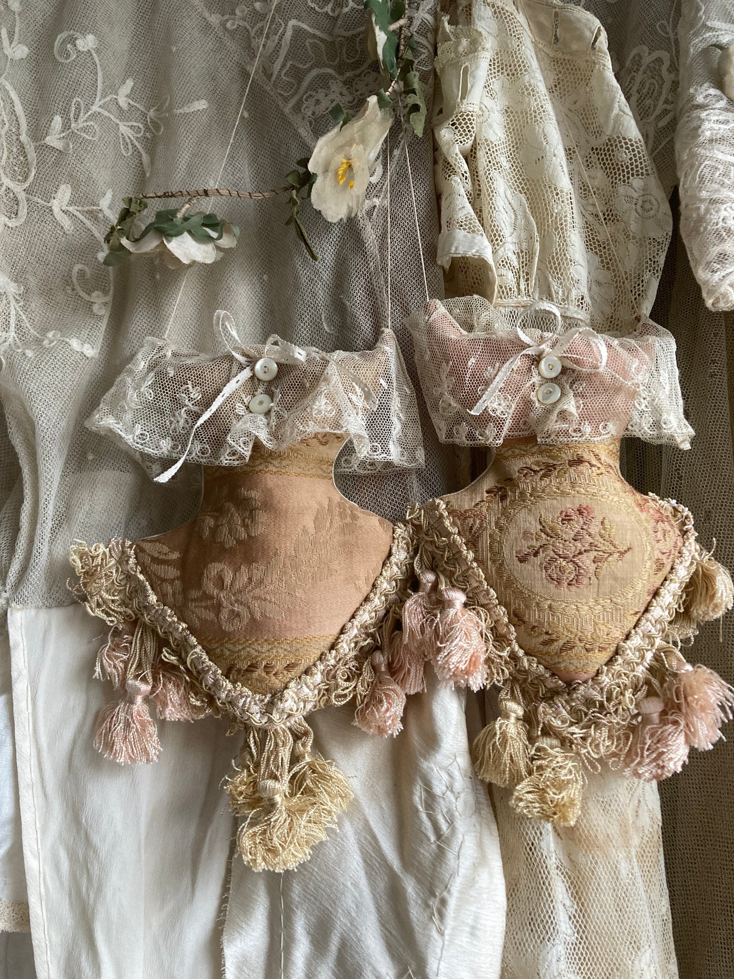 Lavender filled hanging corsets. Antique textiles.